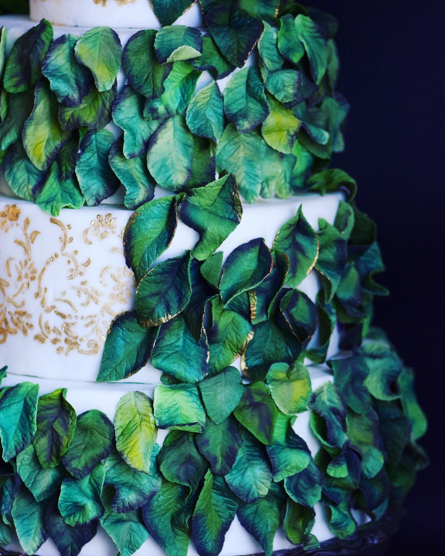 Close-up macro photography of a Chipper & Cheeky detailed gluten-free wedding cake adorned with hyperrealistic delicate, sugar petals decorations for a private celiac-safe private event in Los Angeles County.