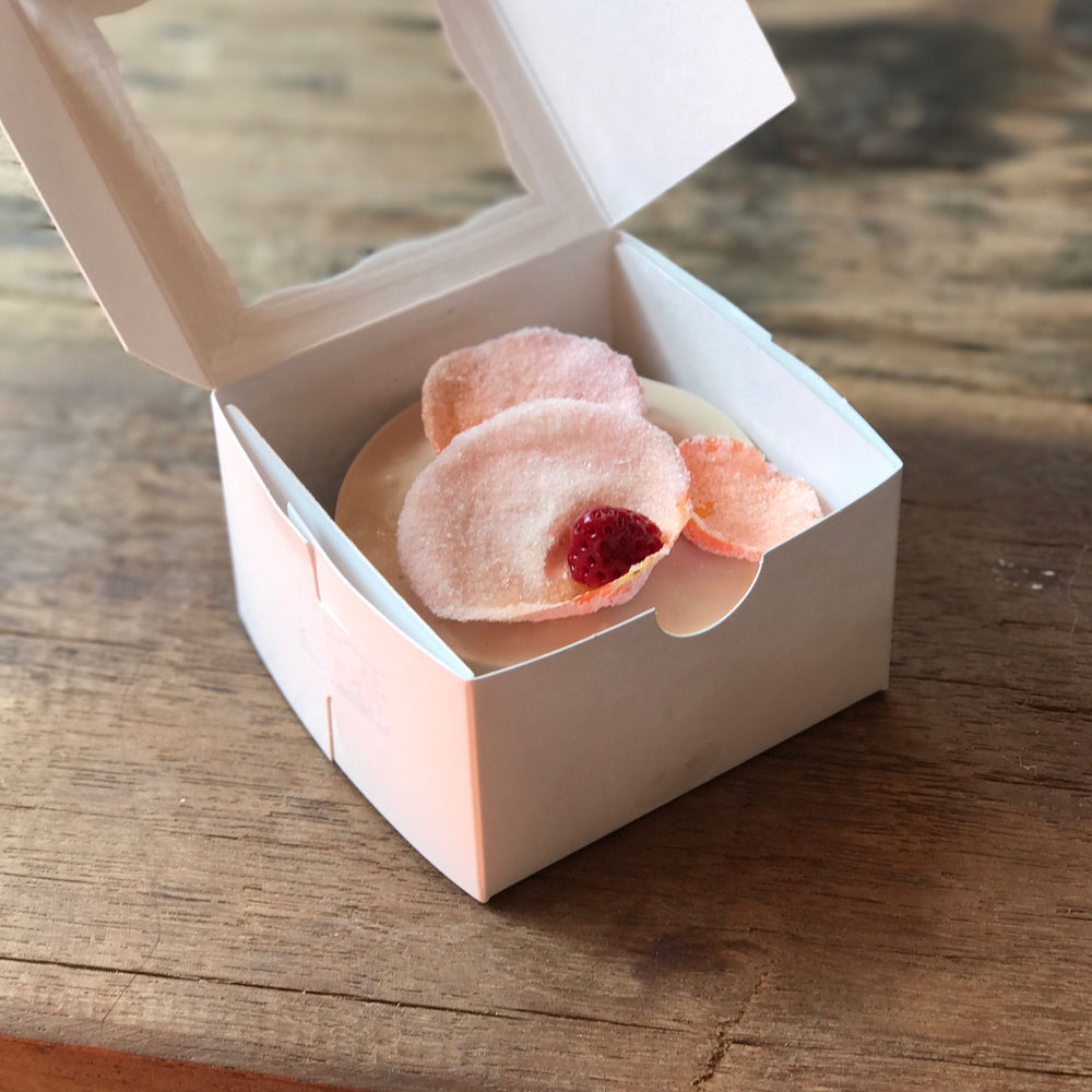 
                      
                        Image of personal cake topped with edible rose petals and strawberries.
                      
                    