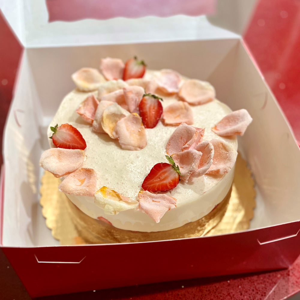 
                      
                        Image of 8" cake topped with edible rose petals and strawberries.
                      
                    